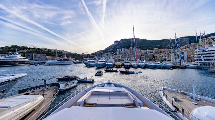 View of Monaco from the bow of a luxurious yacht